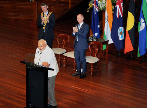 Prime Minister Narendra Modi addresses the audience at a Civic Reception at City Hall in Brisbane, Australia on Sunday PTI Photo
