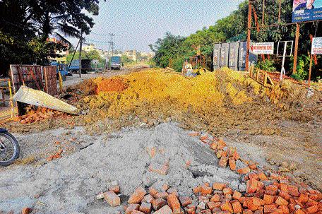 Sanitary work has severely damaged a road in HBR Layout 5th Block. DH photo
