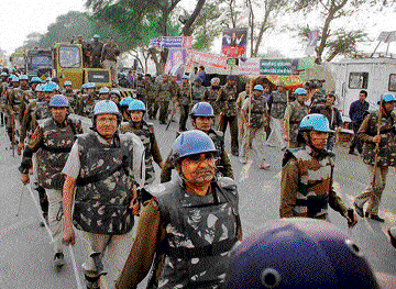Security personnel arrive at Satlok Ashram to arrest Sant Rampal in Hisar on Monday. PTI
