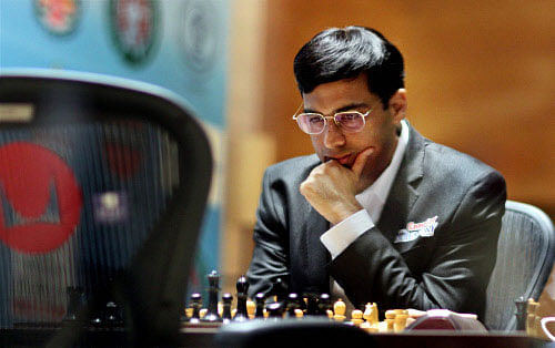 Five-time world champion Viswanathan Anand salvaged a draw after suffering for a long time in the seventh game of the world chess championship against Magnus Carlsen now underway here. PTI file photol
