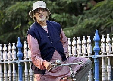 Busy with the shooting of ''Piku'' in the city, filmmaker Shoojit Sircar says Bollywood screen icon Amitabh Bachchan, who stars in the film, behaves like a child on the movie's sets and is open to ideas of substance. PTI file photo
