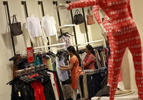 People shop for clothes during a seasonal sale at a store inside a shopping mall in Mumbai. Reuters file photo