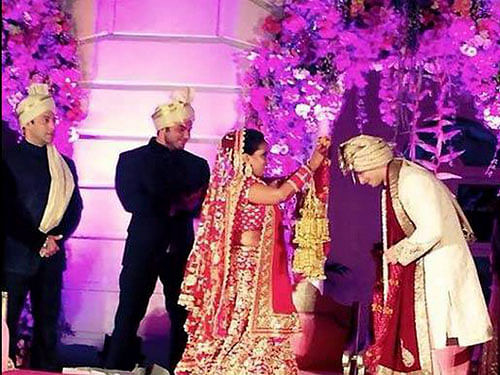 Bollywood star Salman Khan has shared some candid pictures from the grand wedding ceremony of his sister Arpita Khan. AP photo