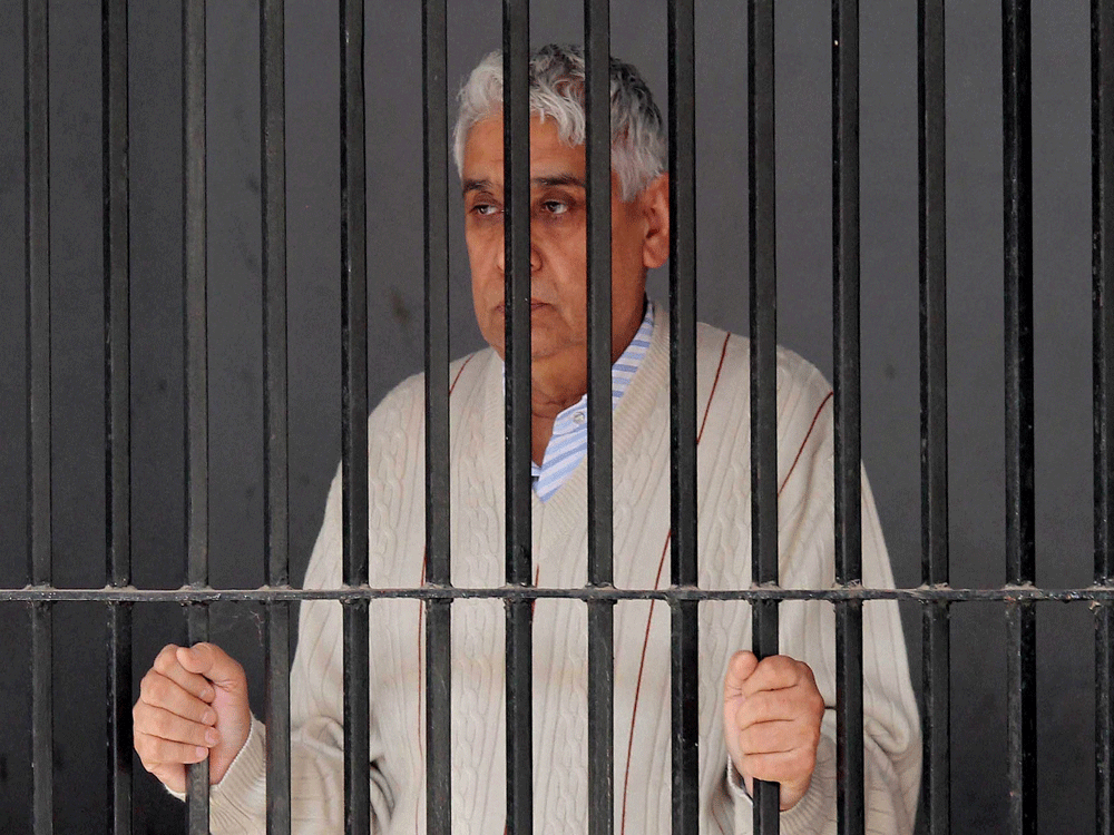 Controversial sect leader Rampal finally appeared before the court Thursday and was sent to police custody after he and his close aides were charged with murder. PTI photo