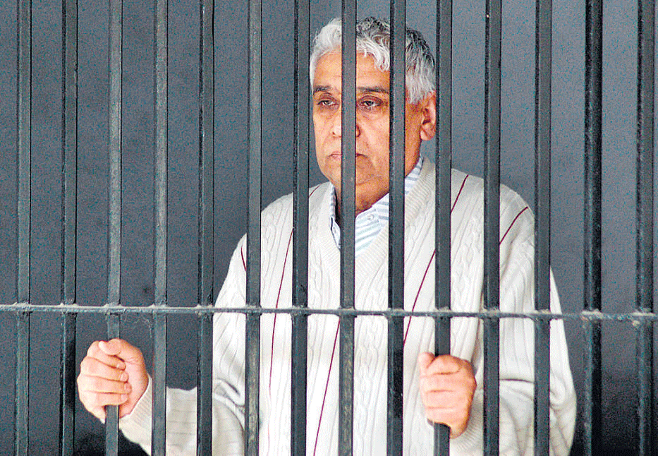 Rampal inside a lockup after his arrest, at Panchkula in Haryana, on Thursday. Reuters