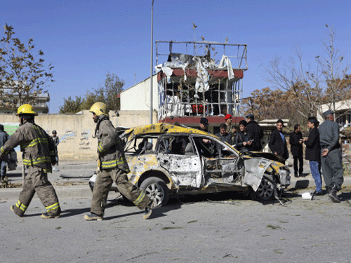 Afghan security forces and emergency personnel work at the site of a suicide attack in Kabul, Afghanistan, Sunday, Nov. 16, 2014. A suicide bomber tried to assassinate Shukria Barakzai, a prominent female member of Afghanistan's parliament on Sunday, killing several people and wounding the lawmaker, a senior official said. AP file photo