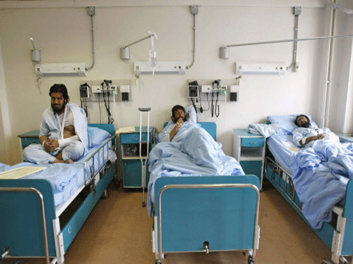 Men receive treatment at a military hospital in Kabul, after being wounded during a suicide attack at a volleyball match on Sunday in the Yahya Khail district of Paktika province. The toll in the suicide bomb attack has risen to 57, with 66 injured being treated in hospital, authorities said Monday. Reuters photo