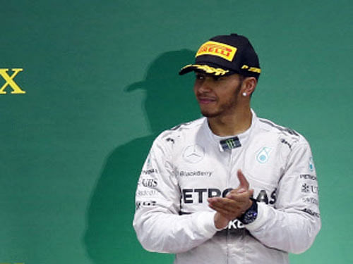 Lewis Hamilton hailed Mercedes team-mate Nico Rosberg as a "phenomenal competitor" on Sunday after the beaten German extended a congratulatory hand to his triumphant Formula One title rival. Reuters photo