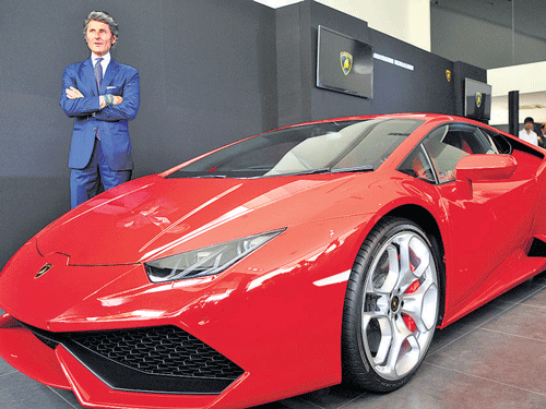 Automobili Lamborghini President and Chief Executive Officer Stephan Winkelmann with the recently launched Huracan  in Bengaluru on Tuesday. DH Photo