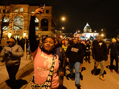 Protest marches have sprang up across the United States, and police battled to stifle another night of unrest in Ferguson, ground zero of America's latest racially-charged riots. AP photo