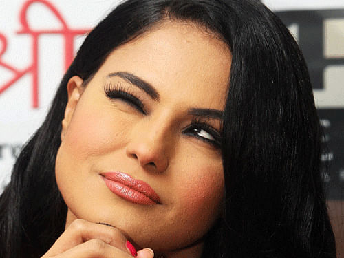 Pakistani actress Veena Malik today expressed shock and disbelief over a Pakistani anti-terrorism court sentencing her and her husband to 26 years in prison for alleged blasphemy. PTI file photo