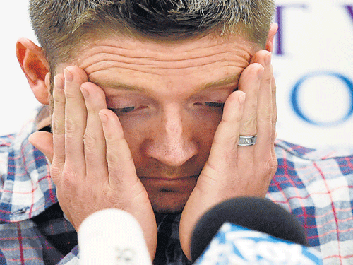 Michael Clarke struggles to contain his emotions while reading Phillip Hughes' death statement. AP Photo