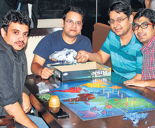 Customers playing a board game at the eatery