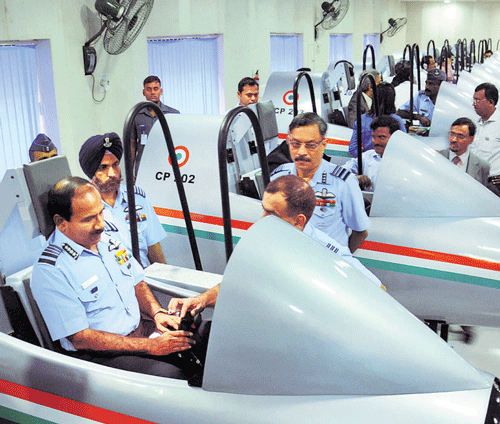 Chief of Air Staff Air Marshal Arup Raha sits in a simulator installed for testing the psychomotor skills, after launching the Computerised Pilot Selection Systemat the Air Force Selection Board inMysuru on Friday. DH PHOTO
