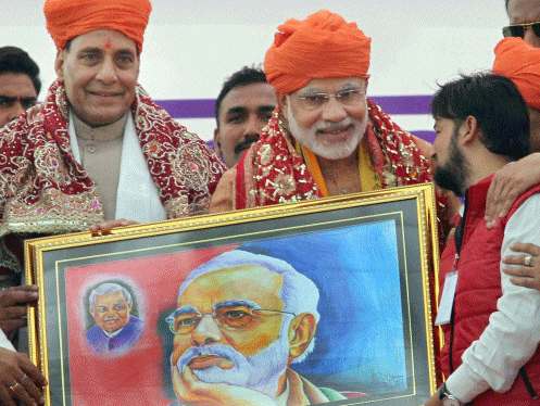 BJP Prime Ministerial candidate Narendra Modi and party president Rajnath Singh being presented with a potrait during an election campaign rally at MA Stadium in Jammu on Sunday. PTI Photo
