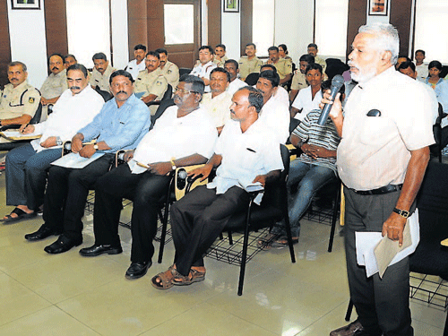 A Dalit leader raises a point at SC/ST monthly grievances meeting at Police Commissioner's office in Mangaluru on Sunday. DH photo