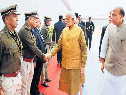Prime Minister Narendra Modi, along with Union Home Minister Rajnath Singh, greets top police officers at All India Conference of DGPs and IGPs in Guwahati on Sunday. PTI