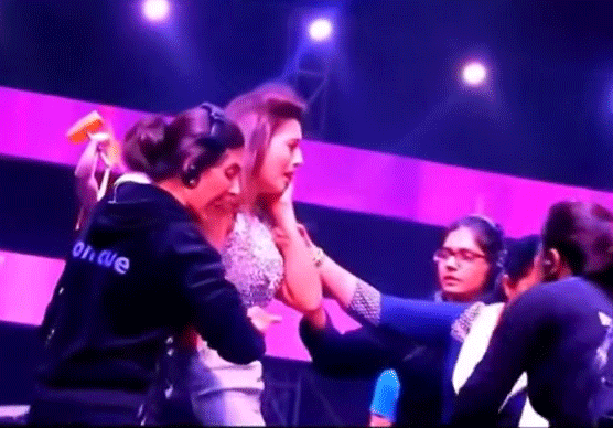 Model and actress Gauahar Khan reacts after being slapped by a man during a reality show shoot. TV grab
