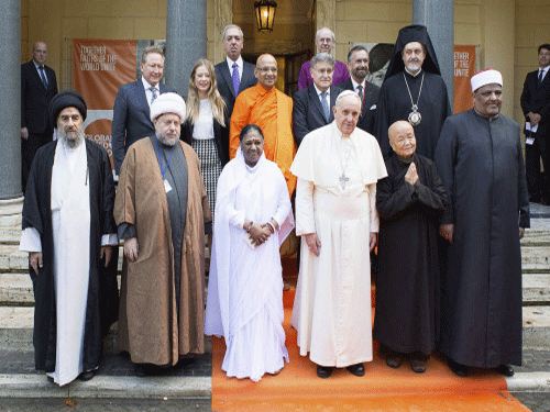 India's Mata Amritanandamayi and Pope Francis today joined 10 other religious leaders from across the globe to sign on a Vatican initiative to eradicate modern-day slavery, including human trafficking and prostitution, by 2020. Reuters photo