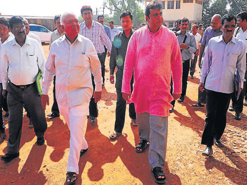 Transport Minister R Ramalinga Reddy arrives at KSRTC depot in Udupi on Wednesday. Udupi MLA&#8200;Pramodh Madhwaraj among others look on. DH photo
