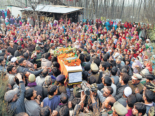 CRPF officials, soldiers and locals carry the body of CRPF jawan Muhammad Shafi Bhat, who was killed in a Maoist attack in Chhattisgarh's Sukma district, at his funeral at Pattan in the Baramulla, North Kashmir, on Wednesday. PTI