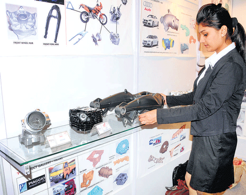 A visitor at the ALUCAST 2014 three-day internationl exhibition, organised by Aluminium Casters Association of India at BIEC in Bengaluru on Thursday. DH Photo/B H Shivakumar