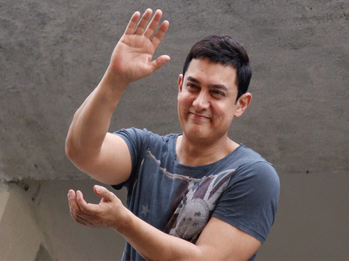 If sources are to be believed, actor Aamir Khan will hold a special screening of 'PK' for Samlan and Shah Ruhk Khan soon.  PTI photo
