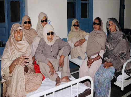 Patients who lost vision after undergoing eye surgery at an eye camp in Amritsar on Friday. PTI Photo