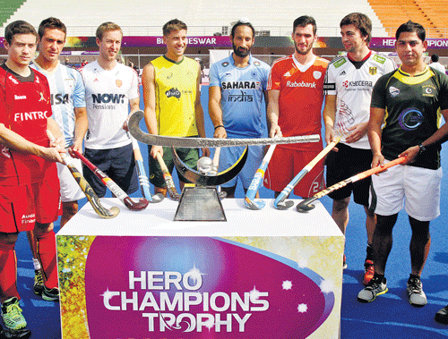 ONE TO PLAY FOR: Captains of all eight teams at the unvieling of the Champions Trophy on Friday. From left: John-John Dohmen (Belgium), Lucas Rey (Argentina), Barry Middleton (England), Eddie Ockenden (Australia), Sardar Singh (India), Robert van der Horst (Netherlands), Tobias Hauke (Germany) and Muhammad Imran (Pakistan) pose with the trophy. Pti.