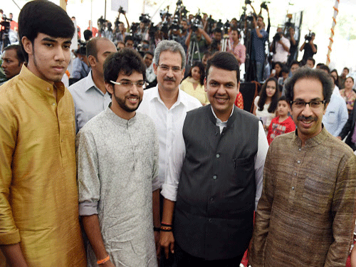 Maharashtra CM Devendra Fhadnavis along with Shiv Sena President Uddhav Thackeray and his sons Tejas and Aditya during the swearing-in ceremony for the new ministers from Shiv Sena in Mumbai. PTI