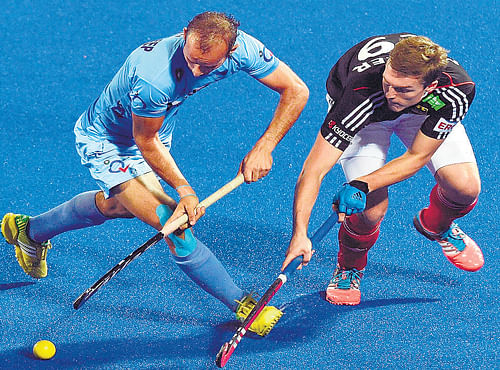 India's Ramandeep Singh (left) tries to dribble past Germany'sMathias Muller in theirChampions Trophymatch in Bhubaneswar on Saturday. Germanywon 1-0. AFP