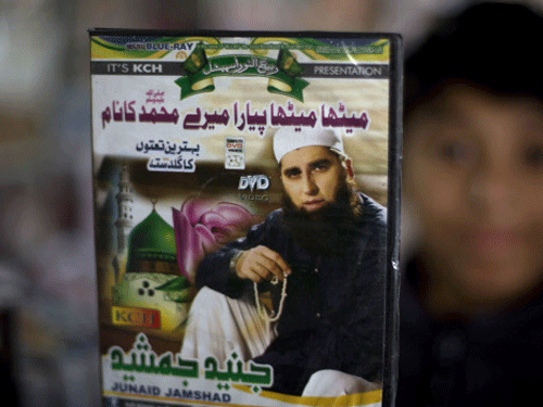 A vendor shows a DVD of Pakistan's Junaid Jamshed at a stall in Islamabad, Pakistan. AP photo