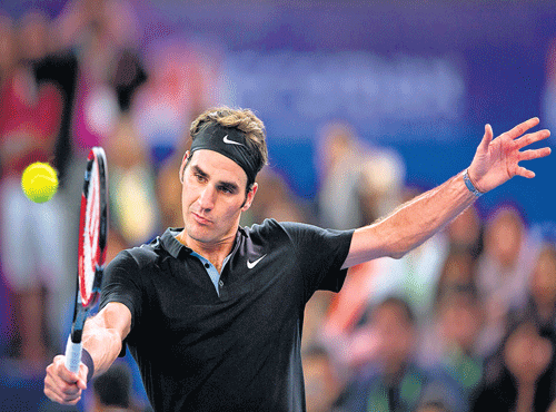 Indian Aces' Roger Federer essays a backhand during his win over TomasBerdych of Singapore Slammers in the International Premier Tennis League inNewDelhi on Sunday. AFP