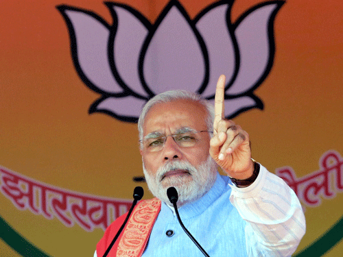 Narendra Modi said a finger pressed on an EVM is more powerful than the one on an AK-47 trigger. PTi File Photo