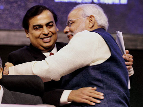 Gujarat Chief Minister Narendra Modi hugs industrialist Mukesh Ambani at the Vibrant Gujarat Global Investors Summit. PTI file photo