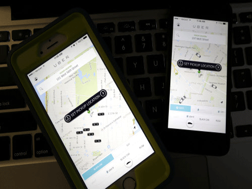 This photo taken in Newark, N.J., shows smartphones displaying Uber car availability in New York. International mobile cab-booking company, Uber, which has been banned by the Delhi government after one of its drivers was arrested on charges of raping a woman, had in the past got into trouble with the German government for violating the country's laws. AP file photo