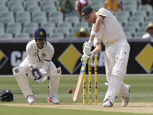 Captain Michael Clarke fought through pain to slam 128, while Steve Smith also produced a career-best hundred against India's hapless bowling attack as Australia piled up a mammoth 517 for seven to take control of the first cricket Test on a rain-truncated second day, here today. AP photo