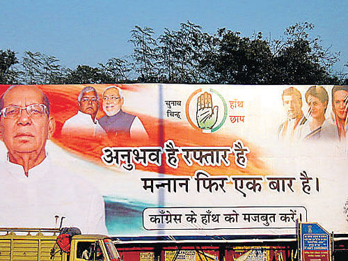 A campaign poster put up by the Congress-led alliance in Jharkhand.