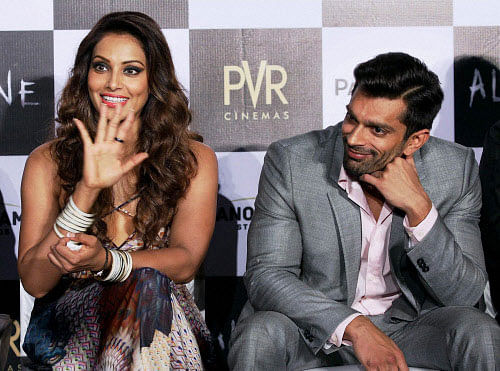 Actor Karan Singh Grover, who is recently making waves in the industry for his alleged affair with bong bombshell Bipasha Basu, seems to be mesmerized by the actress.AP photo