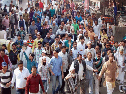 Muslims holding a protest against alleged conversion of some of families of the community, in Agra. A woman converting to Hinduism to marry her lover has sparked tension in Chapar village here, prompting authorities to tighten security. PTI photo