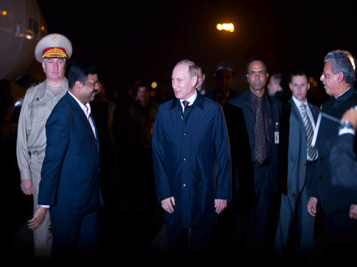 Russian President Vladimir Putin, centre, is greeted on arrival in New Delhi. India and Russia would seek to outline a joint vision of their ties and also ink major agreements in the field of energy, defence and trade as Prime Minister Narendra Modi and Russian President Vladimir Putin hold talks under the 15th Annual India-Russia Summit here Thursday. AP photo
