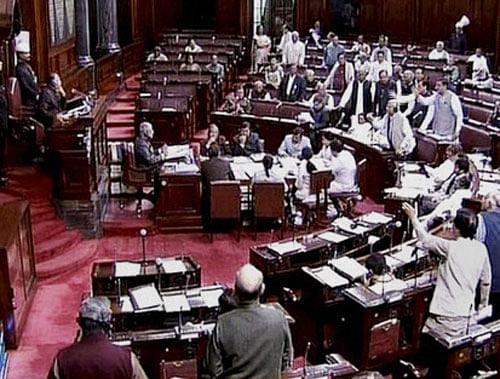 Rajya Sabha today witnessed uproarious scenes with members from Congress lodging strong protest against eulogising of Nathuram Godse at a function held in Maharashtra earlier this month. PTI image/TV grab