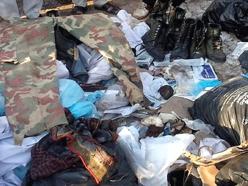 The uniforms of 14 men who died in an ambush by Naxals on Monday in Chhattisgarh were found on Tuesday night along with garbage outside a hospital where the bodies of the martyrs were autopsied. PTI Photo