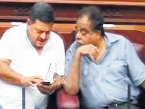 Former minister S S Mallikarjun and Minister Ambareesh in the Assembly.