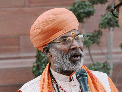 BJP member Sakshi Maharaj talks to the media during the winter session of the Parliament in New Delhi. A united opposition today forced BJP member Sakshi Maharaj to express regret in Lok Sabha and withdraw his remarks terming Mahatma Gandhi's assassin Nathuram Godse a patriot. PTI photo