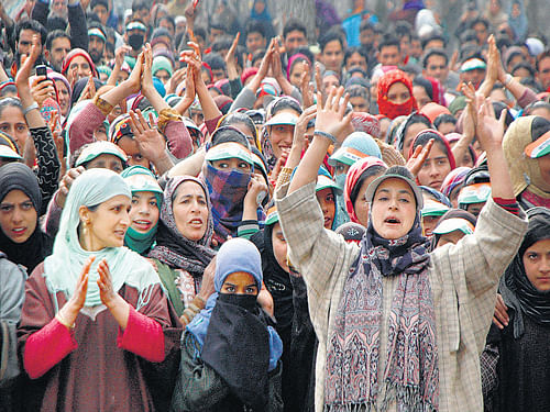 voicing support: Supporters of Congress leader Ghulam Nabi Azad shout during an election rally in Pahalgam on Friday. pti