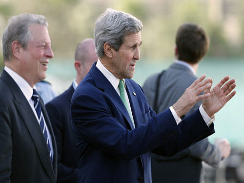 U.S. Secretary of State John Kerry, speaks with former US Vice President Al Gore, during the U.N. Climate Change Conference in Lima, Peru. The talks in Lima ran into extra time as the negotiators today struggled to break a deadlock between rich and developing countries aiming to the draft text of a new agreement to be signed in Paris next year. AP photo