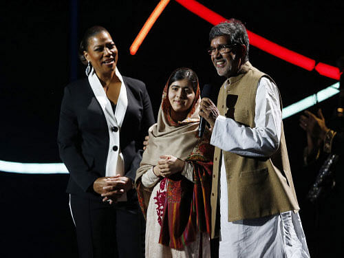 The sight of blood-spattered school uniform she was wearing the day the Taliban shot her, made Pakistan's teen Nobel laureate Malala Yousafzai burst into tears, prompting fellow awardee India's Kailash Satyarthi to comfort her saying 'you are so brave'. AP photo