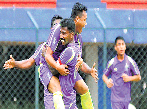 ASC's Jotin Singh (left) celebrates his goal with team-mate Ramain the Puttaiah Memorial Cup for Super Division teamsin Bengaluru on Saturday. DH PHOTO
