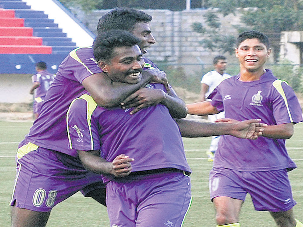 MATCHWINNER: ASC's Ramachandra (centre) celebrates with team-mates after scoring against Student Union. DH PHOTO